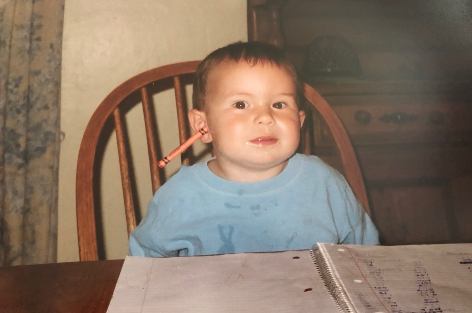 Me with a crayon in my ear as a baby.